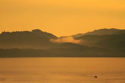 Scenic view of mountains at sunset