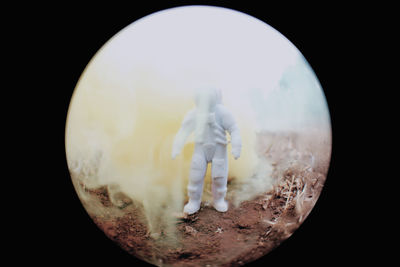 Digital composite image of illuminated light against black background