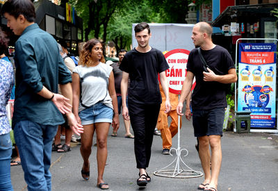 People standing on street in city