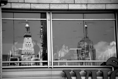 Illuminated building seen through glass window