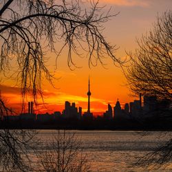 Silhouette of city during sunset