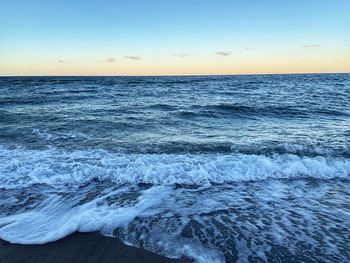 Scenic view of sea against sky during sunset