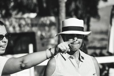 Portrait of man holding hat