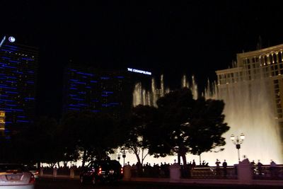 Low angle view of illuminated buildings at night