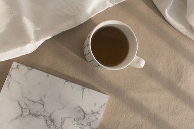 High angle view of coffee cup on table