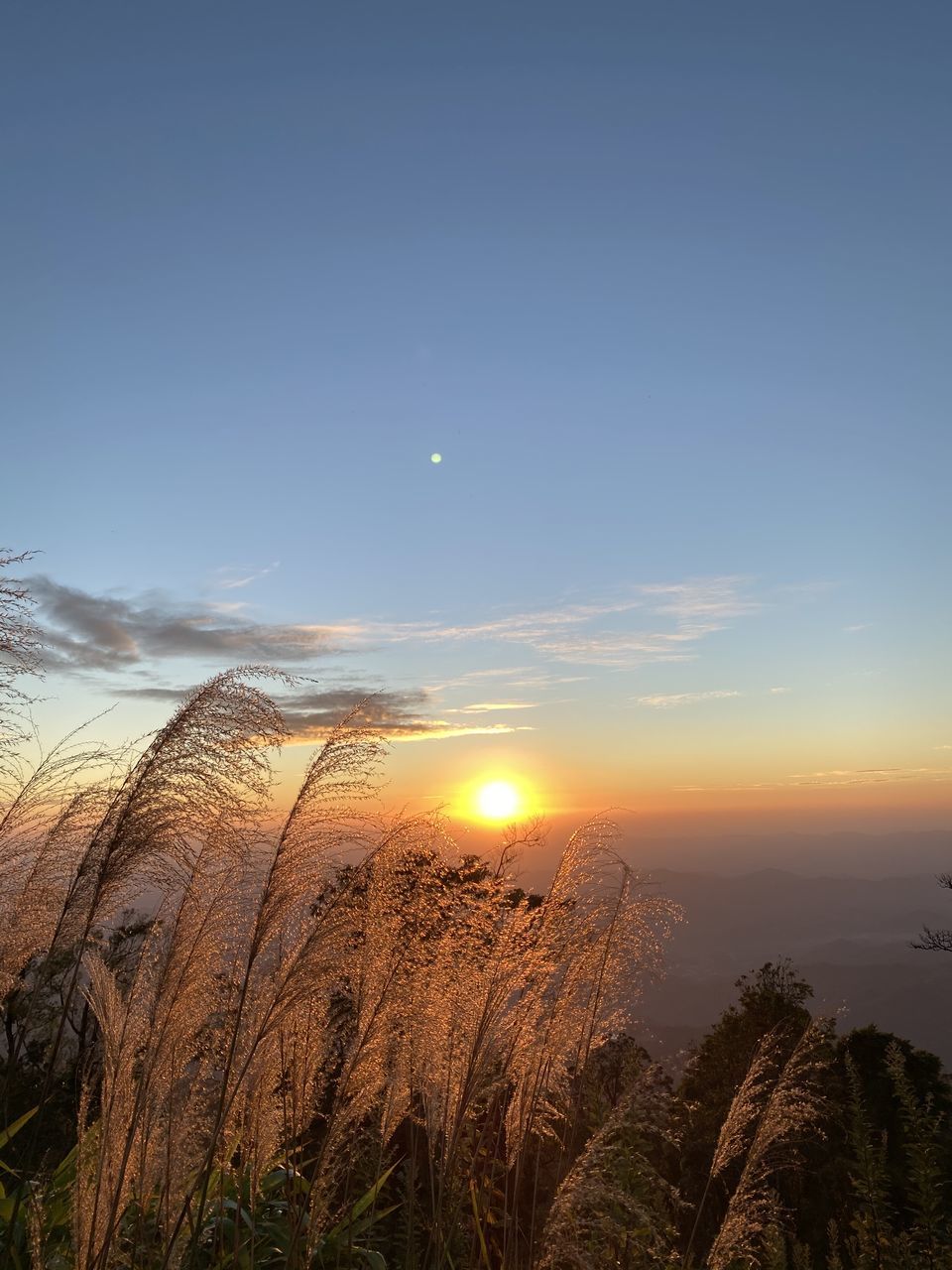 SCENIC VIEW OF SUNSET OVER LANDSCAPE