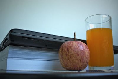 Close-up of orange juice on table