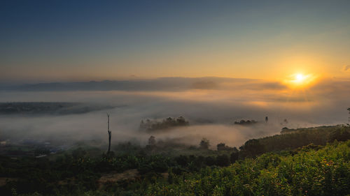 Scenic view of landscape against sky during sunset