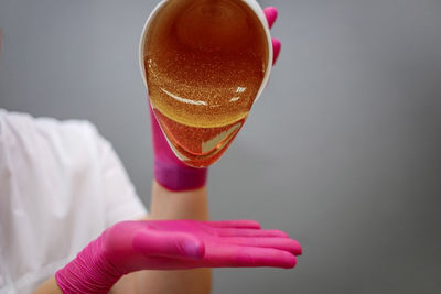 Close-up of hand holding ice cream