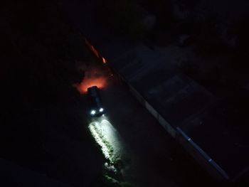 High angle view of illuminated car in sea at night