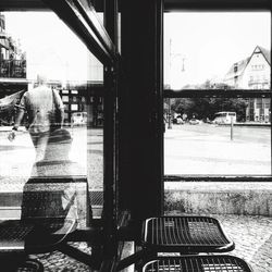 Cars on street seen through window