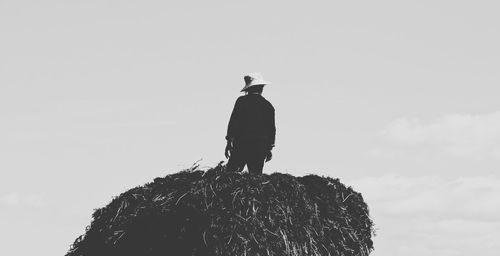 Low angle view of man against clear sky