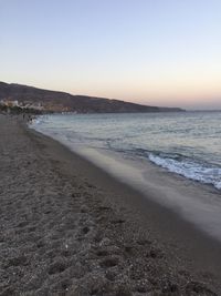 Scenic view of beach against clear sky