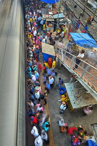 High angle view of people walking on street