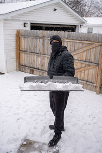 Man standing on snow covered outdoors