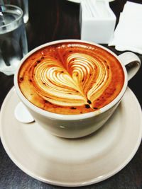 Close-up of cappuccino on table