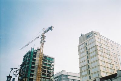 Low angle view of buildings against sky in city