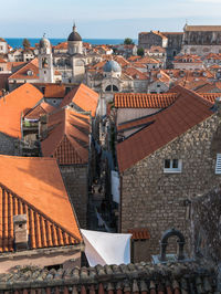 Buildings in town against sky