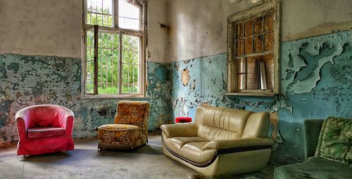 Empty chairs in abandoned building