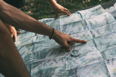 Planning the route on a map and a compass