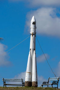 Low angle view of communications tower against sky