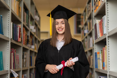 Portrait of smiling woman in graduation