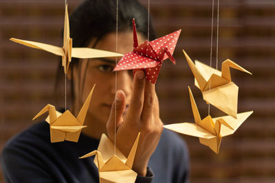 Close-up of woman holding paper