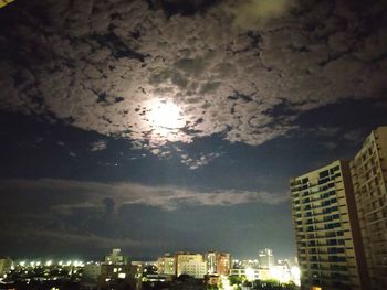 Low angle view of illuminated buildings against sky