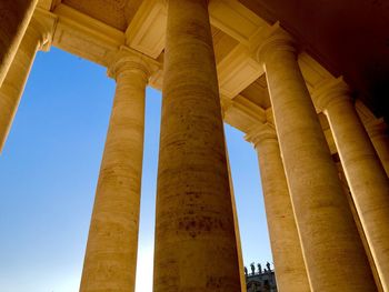 Low angle view of colonnade against clear sky