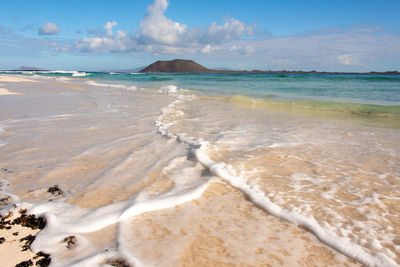 Scenic view of beach against sky