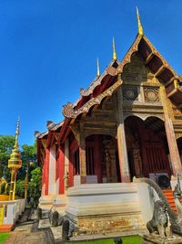 Low angle view of temple against building