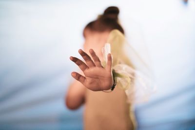 Close-up of woman hand gesturing stop sign