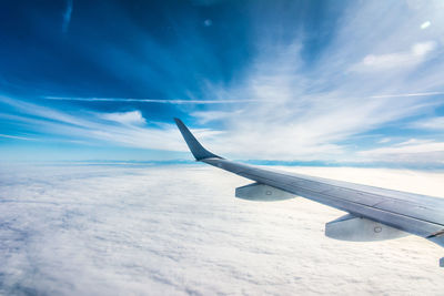 Airplane flying against sky