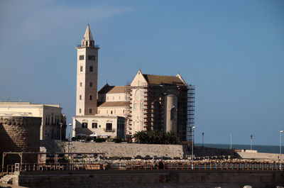 Trani, italy, 4 december 2022, the cathedral and the fort seen from the roof garden on the sea