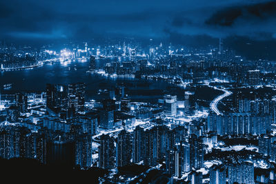 High angle view of illuminated buildings in city at night