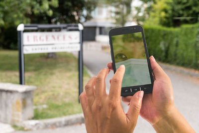 Man photographing with mobile phone