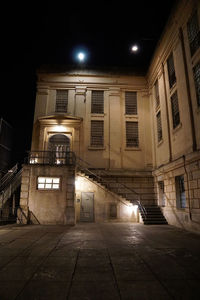 Low angle view of illuminated building at night