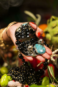 Close-up of hand holding berries