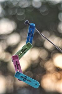 Close-up of clothespins on clothesline