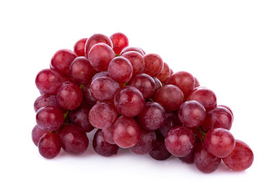 Close-up of grapes against white background