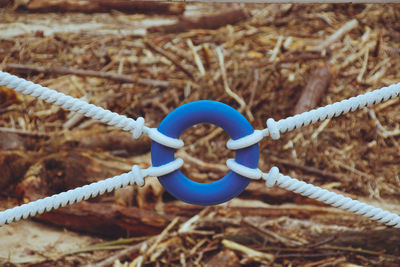 Close-up of rope tied up on metal