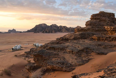 Scenic view of rock formations against sky during sunset