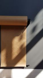 High angle view of electric lamp on table against wall