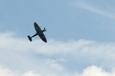 Low angle view of airplane against sky