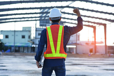 Rear view of man working at construction site