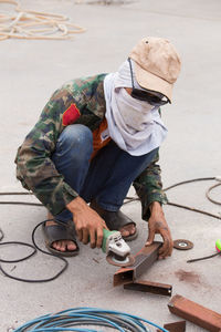 High angle view of man working on street