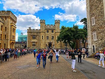 Group of people in front of buildings