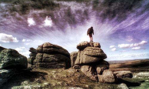 Scenic view of rock formation against cloudy sky