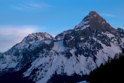 Scenic view of snowcapped mountains against sky during winter