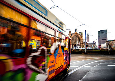 Blurred motion of train against sky in city